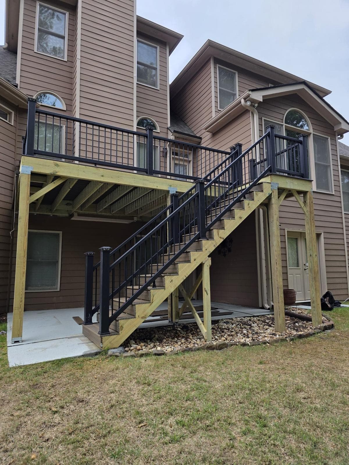 Black aluminum deck and stair railings installed on a rebuilt deck in Metro Atlanta